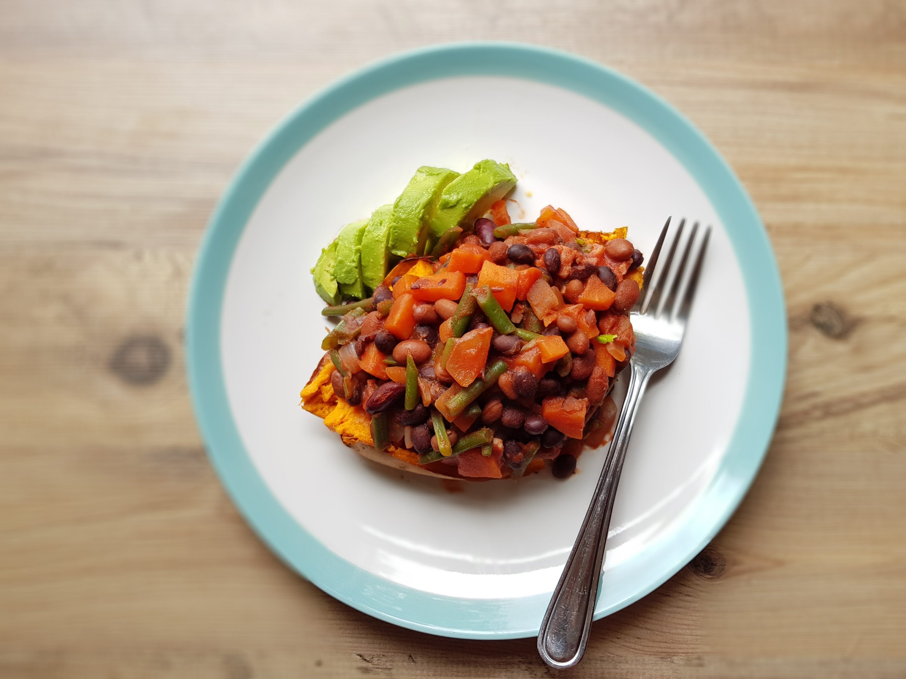 Baked sweet potato and chipotle beans