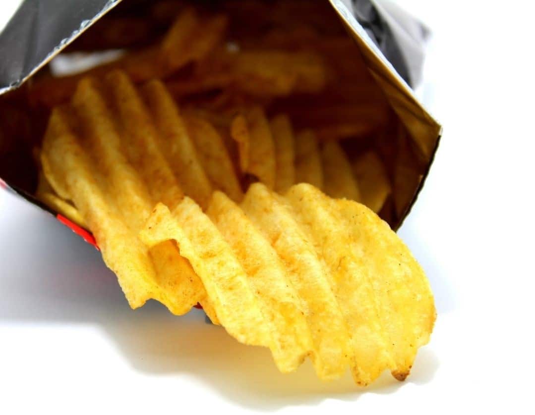 snack of crisps coming out of open packet