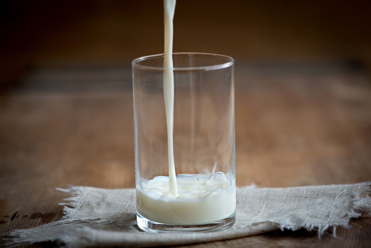 milk being poured into a glass